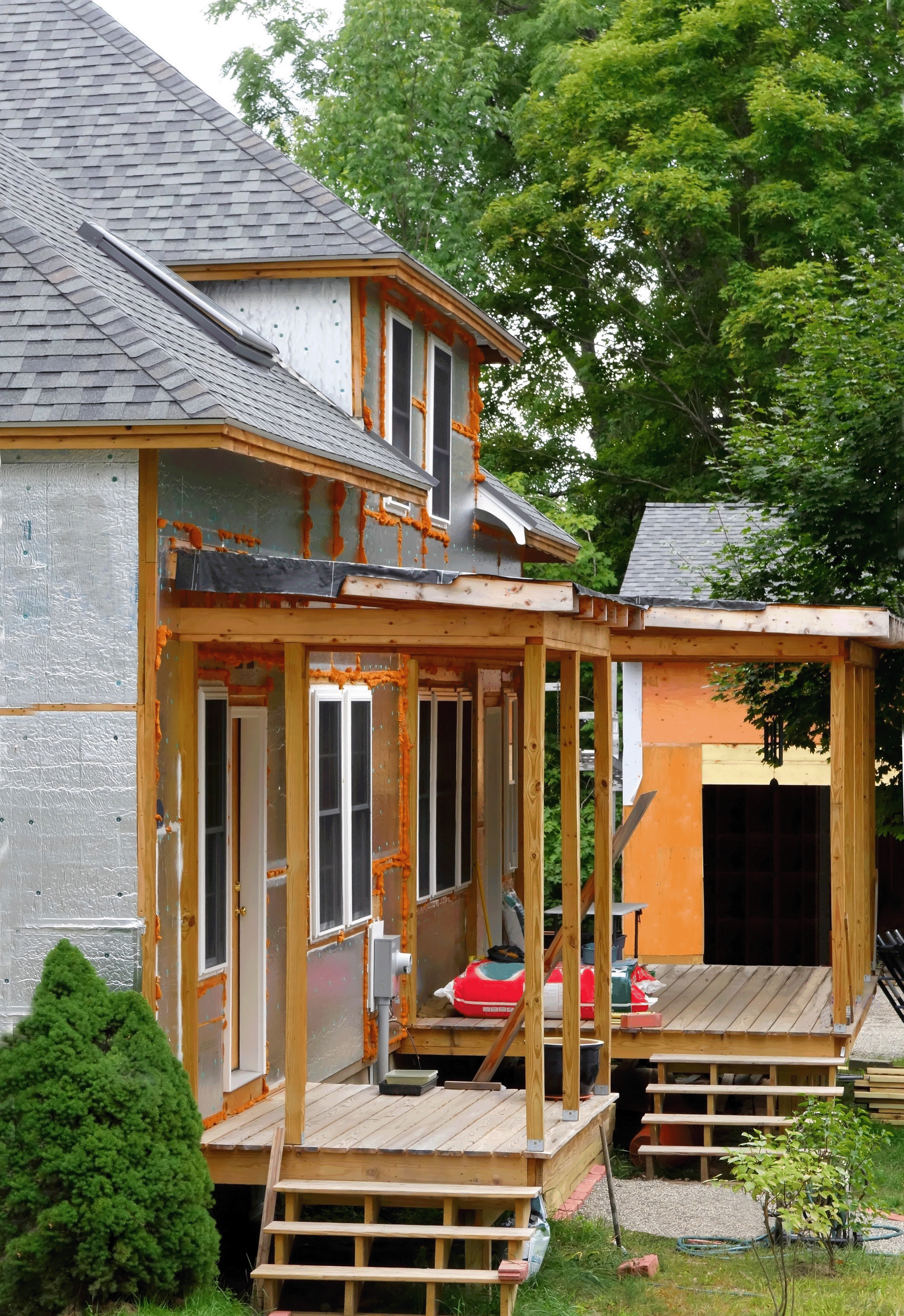 Freshly rebuilt front porch with new railings and paint